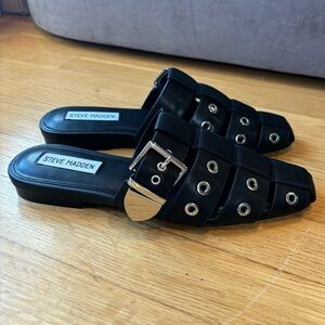 Black leather Steve Madden mules with silver buckle